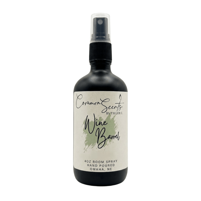 4oz Luxury Room Spray | CommonScents by Tayler E featuring a sleek black bottle with a spray nozzle and a minimalist label for a sophisticated wine barrel scent.