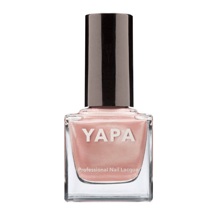 Caroline Nail Lacquer | YAPA in a soft, pearlescent pink shade with a sleek black cap, designed for professional-quality nail care and polish.
