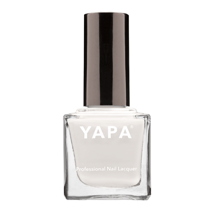 Clear glass bottle of Connie (Color: White) Nail Lacquer | YAPA with black cap featuring a sleek, professional design for premium nail care and polish application.