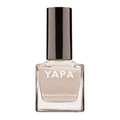Lauren Nail Lacquer | YAPA in a sleek clear glass bottle with a soft beige nail polish shade and a shiny black cap, ideal for professional nail care and styling.
