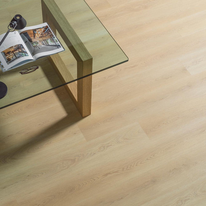 Wooden coffee table with a glass top on a wood effect luxury vinyl floor.