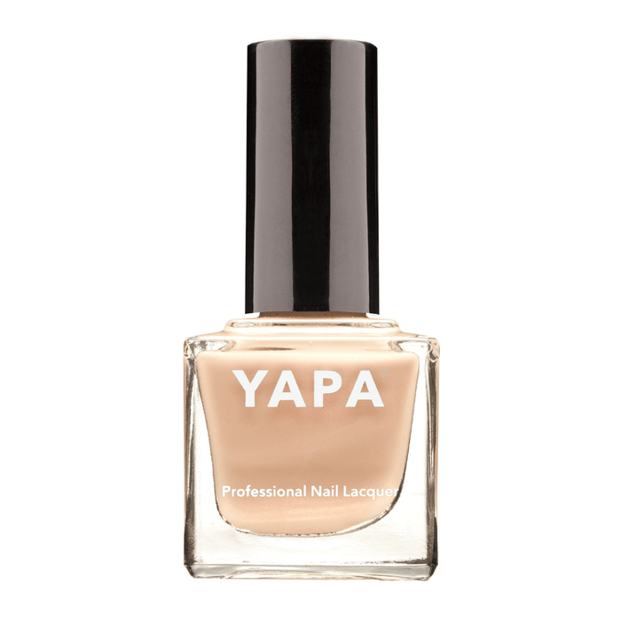 Bottle of Rachel Nail Lacquer | YAPA in a soft nude beige shade with a black cap, designed for professional-quality nail care and beauty.
