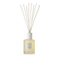 Minimalist reed diffuser with light yellow liquid in frosted glass bottle, styled for calming ambiance and wellness, Tranquillity Home Fragrance | [ comfort zone ].