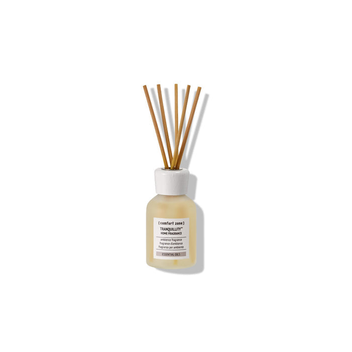 Glass diffuser bottle with wooden reeds containing Tranquillity Home Fragrance | [ comfort zone ] for calming wellness and a serene home atmosphere.